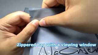 Tas berritsleting dengan jendela penglihatan